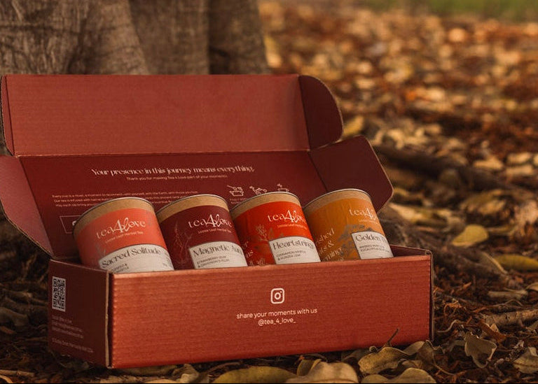 Box of tea jars under a tree with a natural background