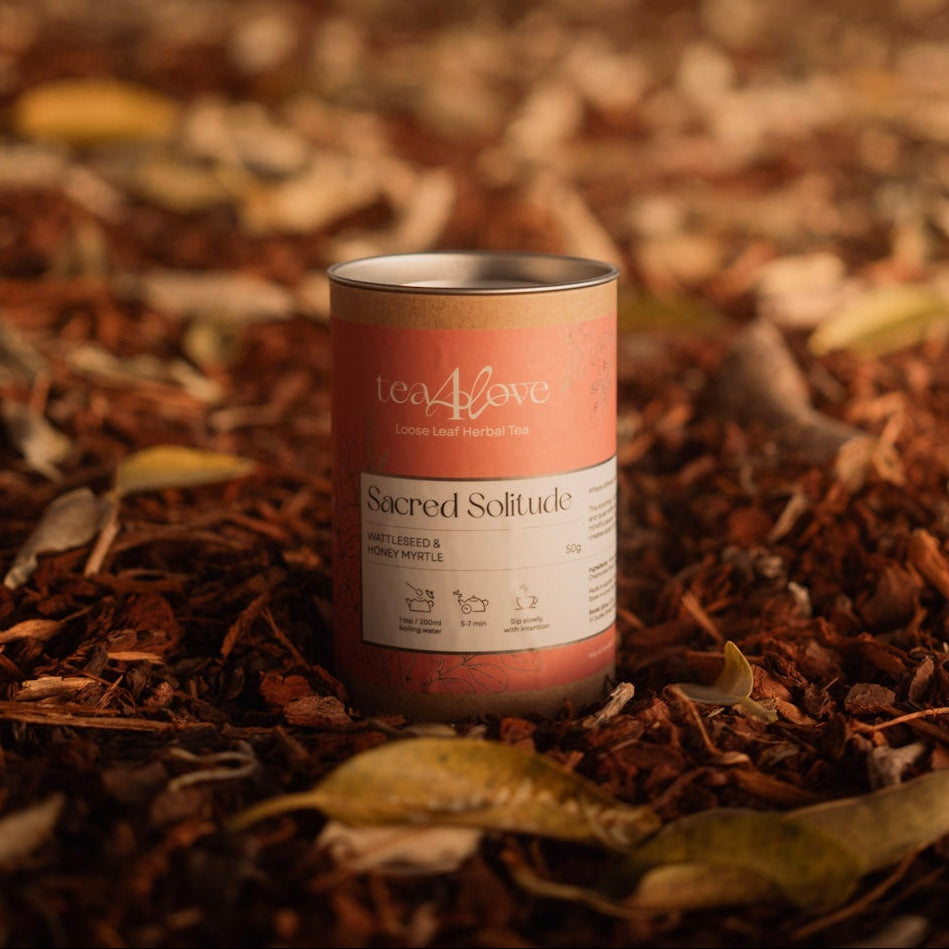Canister with a label on a bed of leaves